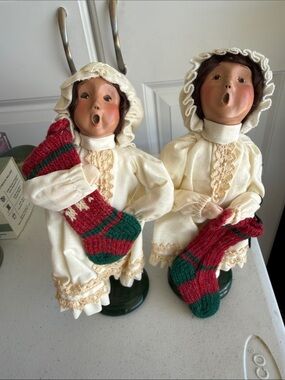 Pair of Cream Victorian-Style Caroler Dolls with Red & Green Stockings